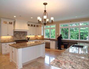 Electrician wiring modern ceiling lights during a home remodel in Austin